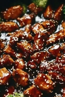 Delicious easy teriyaki chicken served on a plate with sesame seeds and green onions