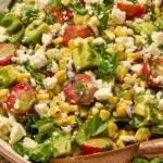 Delicious grilled corn salad featuring fresh tomatoes and avocado