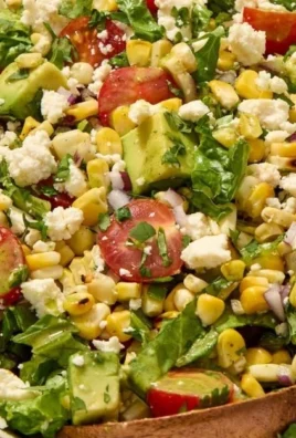 Delicious grilled corn salad featuring fresh tomatoes and avocado
