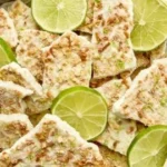 Key lime pie yogurt bark topped with lime zest and crust pieces