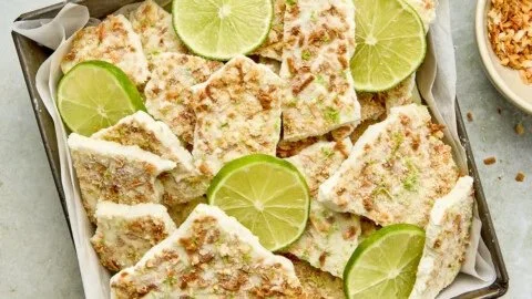 Key lime pie yogurt bark topped with lime zest and crust pieces