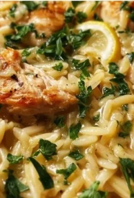 Delicious Lemon Chicken Orzo served in a bowl with fresh herbs