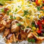 Loaded Chicken Fajita Rice Bowl with colorful veggies and flavorful chicken.