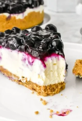 Delicious no bake blueberry cheesecake topped with fresh blueberries.