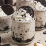 Delicious No Bake Oreo Cheesecake Cups topped with crushed Oreos