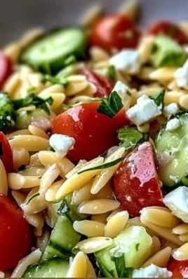 Delicious Orzo Pasta Salad with colorful vegetables for a picnic