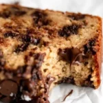 Moist and fluffy Protein Banana Bread sliced on a wooden cutting board