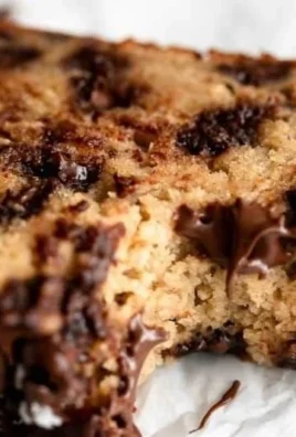 Moist and fluffy Protein Banana Bread sliced on a wooden cutting board
