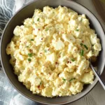 Protein-packed cottage cheese egg salad in a bowl with fresh herbs