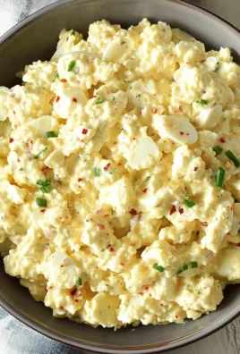 Protein-packed cottage cheese egg salad in a bowl with fresh herbs