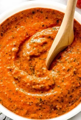 Bowl of Sicilian Tomato Pesto with fresh basil and tomatoes