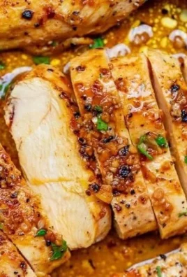 Skillet Garlic Butter Chicken served in a pan with herbs and spices