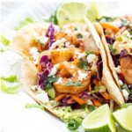 Delicious spicy shrimp tacos with fresh toppings and vibrant colors