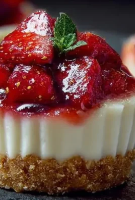 No-bake strawberry cheesecake cups with fresh strawberries and graham cracker crust
