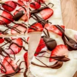Strawberry yogurt bark topped with dark chocolate for a refreshing dessert