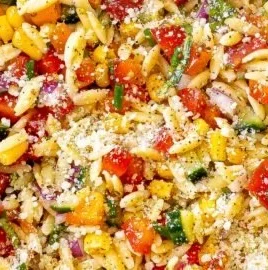 Colorful Summer Orzo Pasta Salad with fresh vegetables and herbs