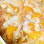 Delicious super easy peach cobbler with fresh peaches and a crumbly topping
