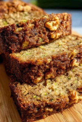 Homemade zucchini bread loaf on a wooden table